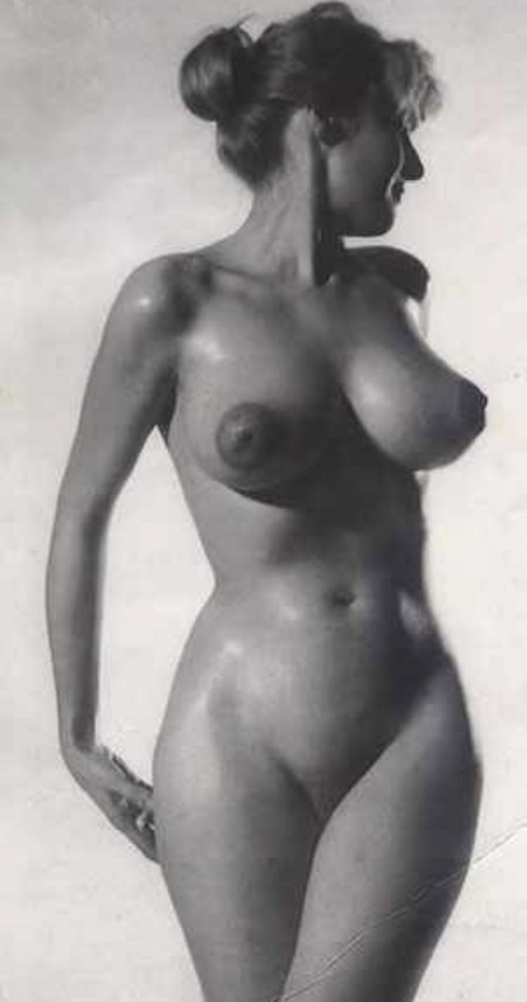 Naked girls with a figure of sand clock