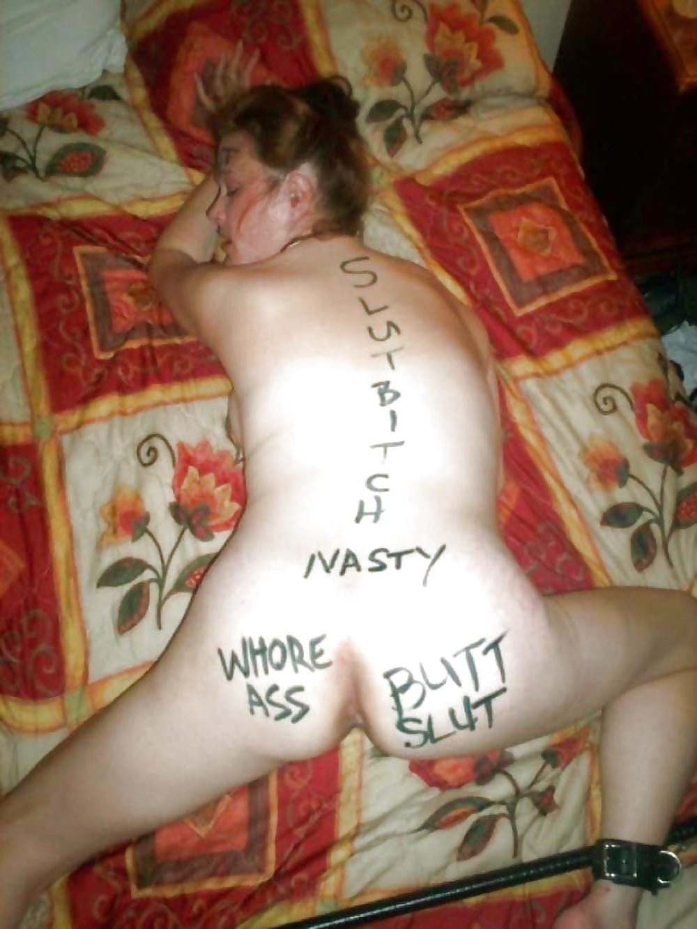 Humiliating inscriptions on naked