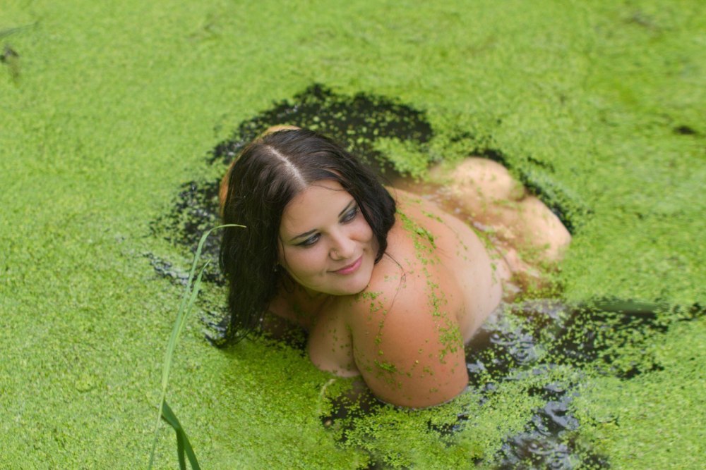 Naked bathes in a swamp