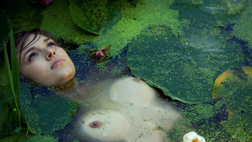 Naked beauty in a swamp