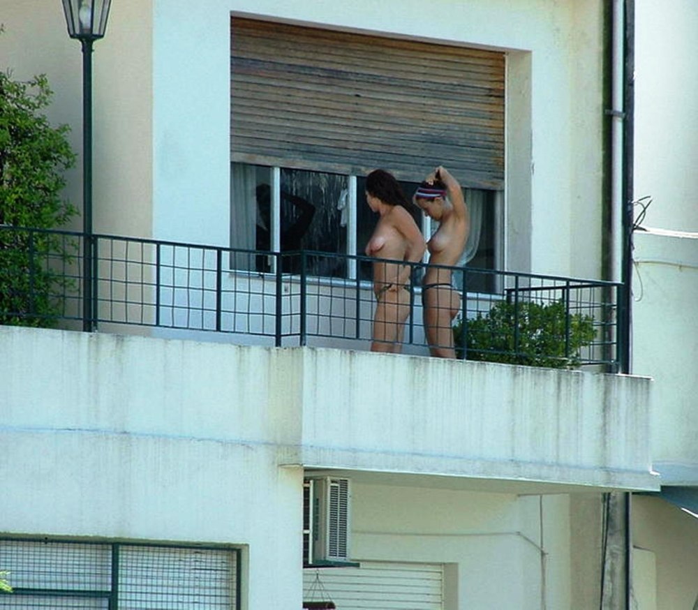 Peeping out the window behind the neighbor